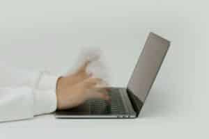 Hands going really fast on laptop